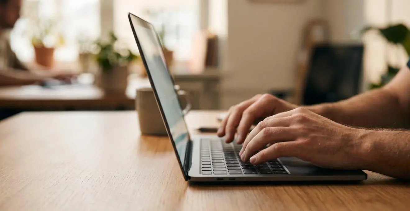Clean minimalist workspace showing automated financial workflow with natural ambient lighting