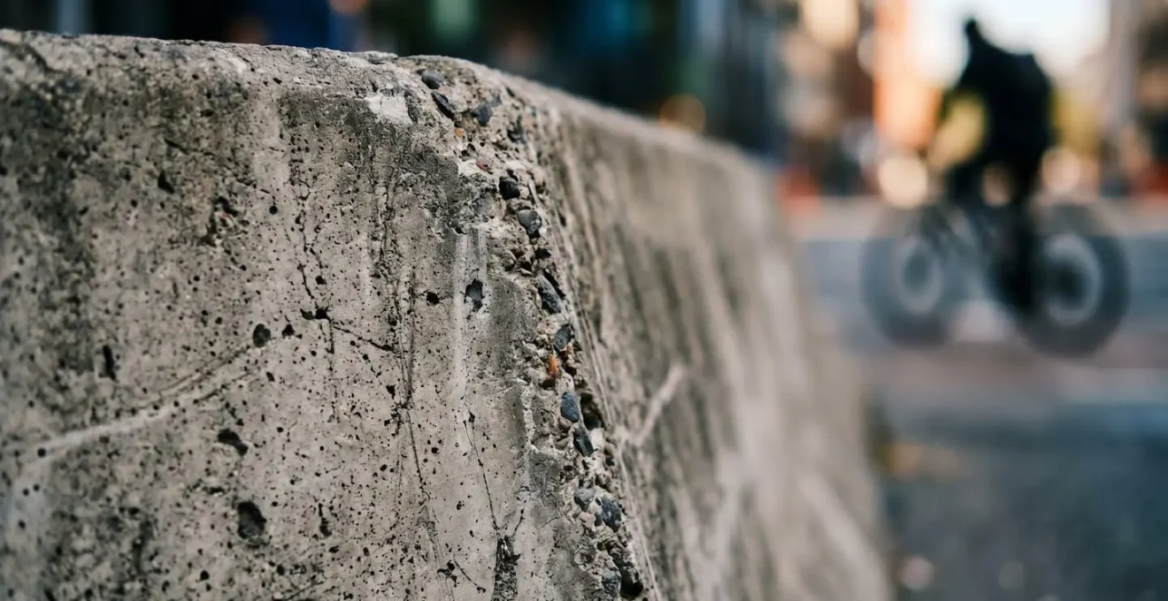 Macro close-up of cycle lane protective barrier texture showing infrastructure quality and material detail