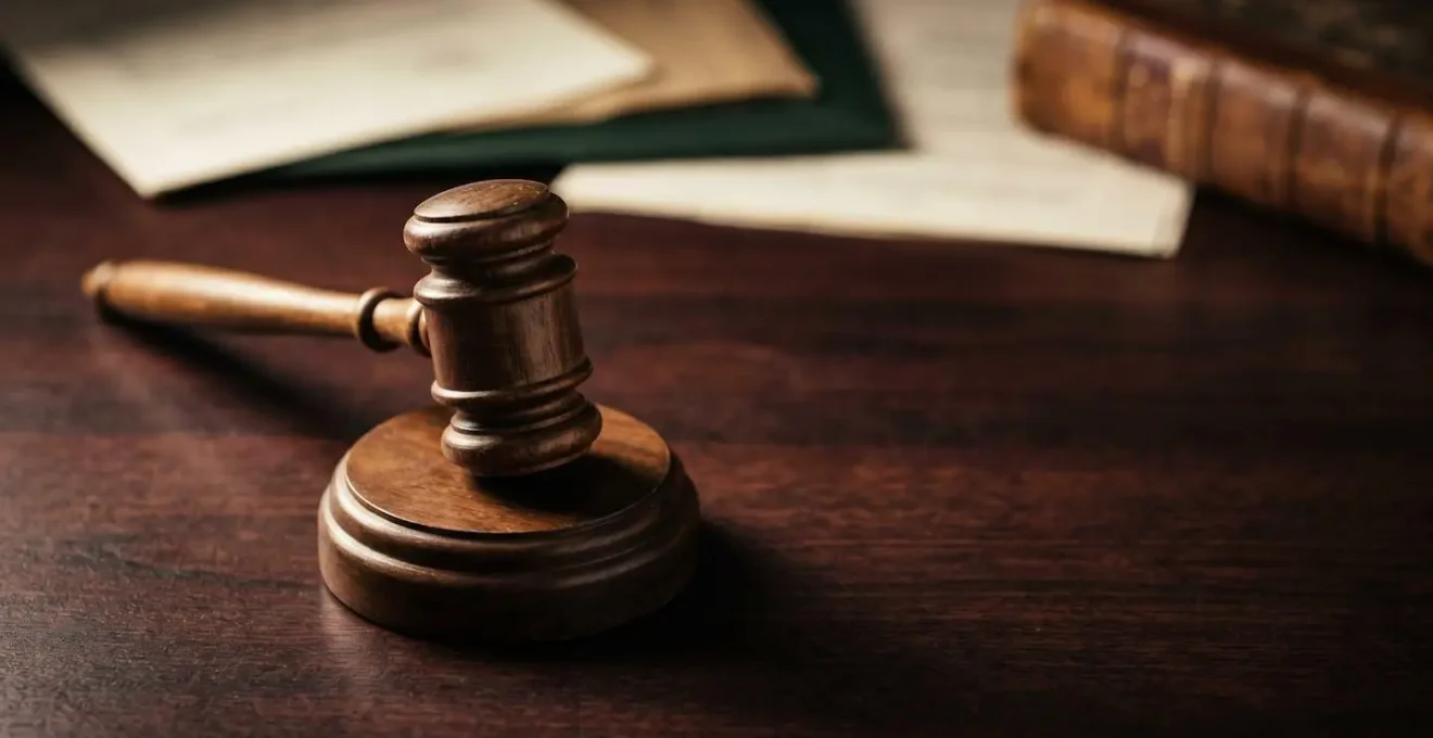 Abstract symbolic representation of UK legal framework with gavel and official documents in formal British legal context