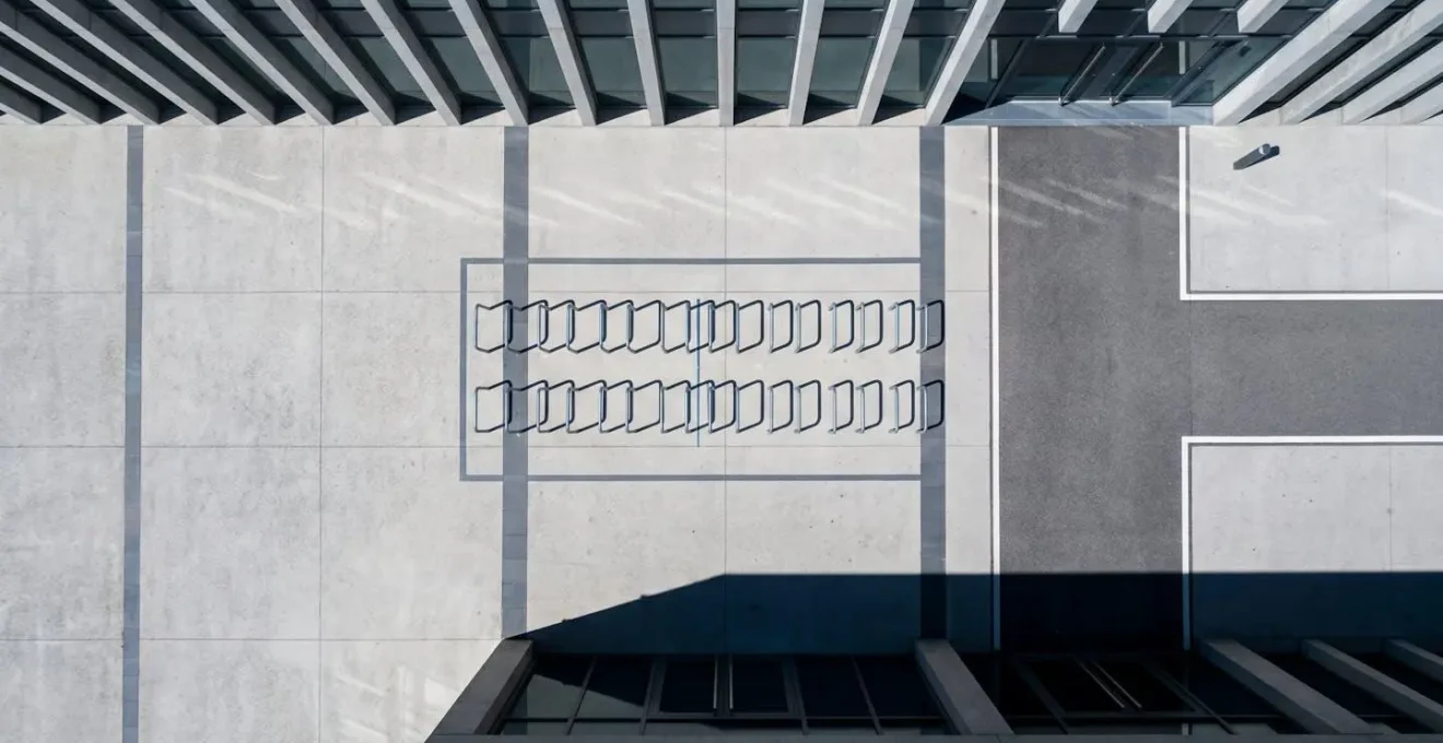 Overhead view showing proper spacing and clearance around bike parking infrastructure on urban sidewalk