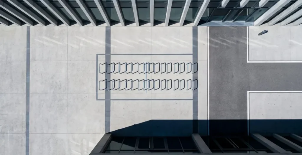 Overhead view showing proper spacing and clearance around bike parking infrastructure on urban sidewalk